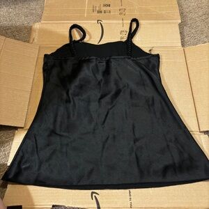 black satin tank top flares out towards bottom